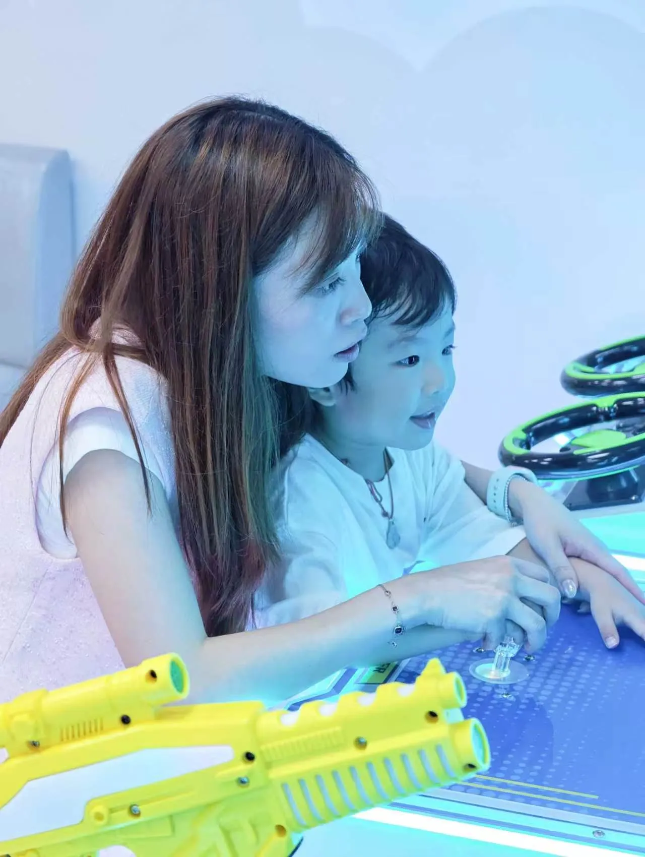 Family playing with ball blasters, Kidstation North Point