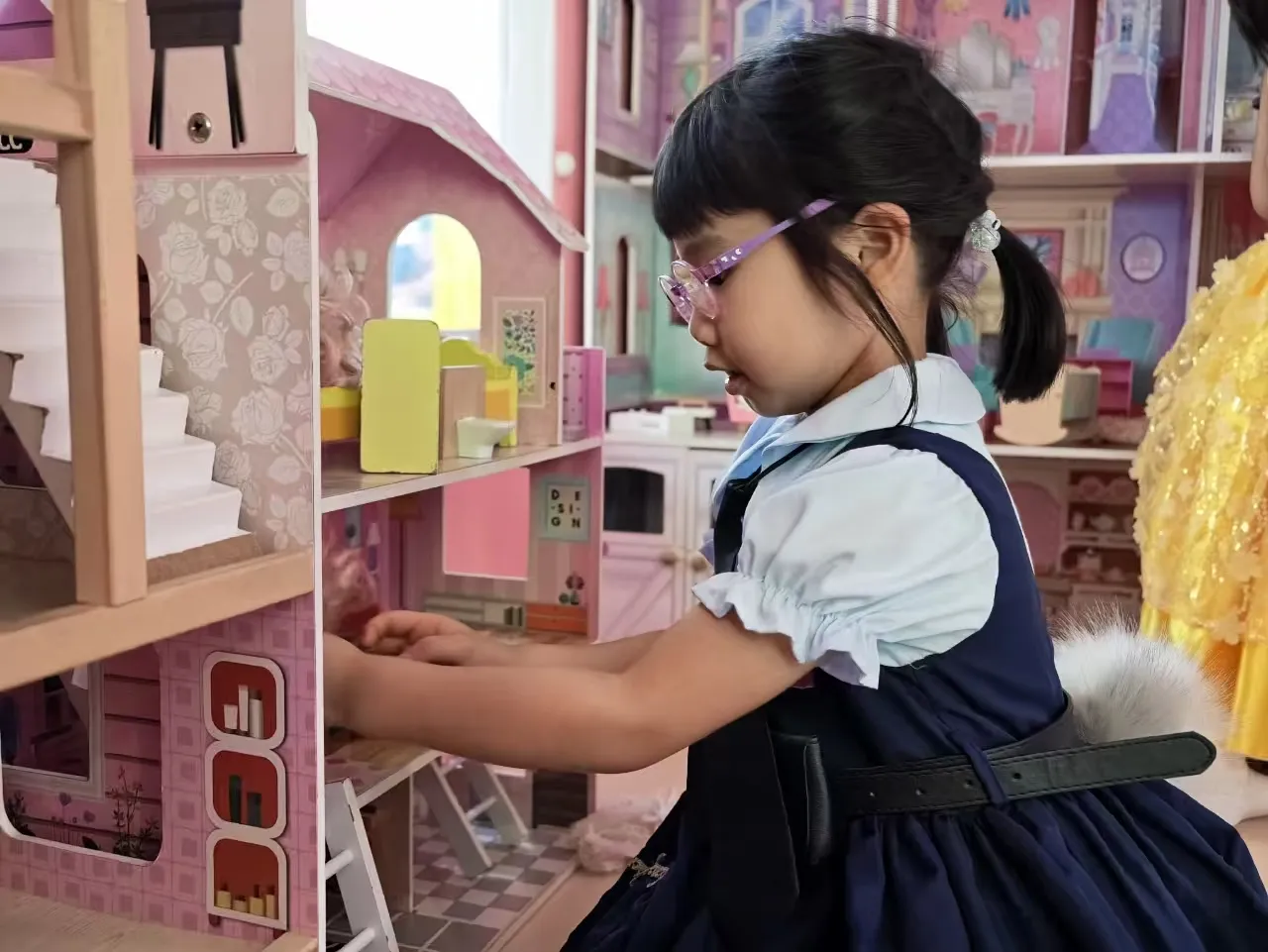 Child playing at the dollhouse, Kidstation Tsuen Wan