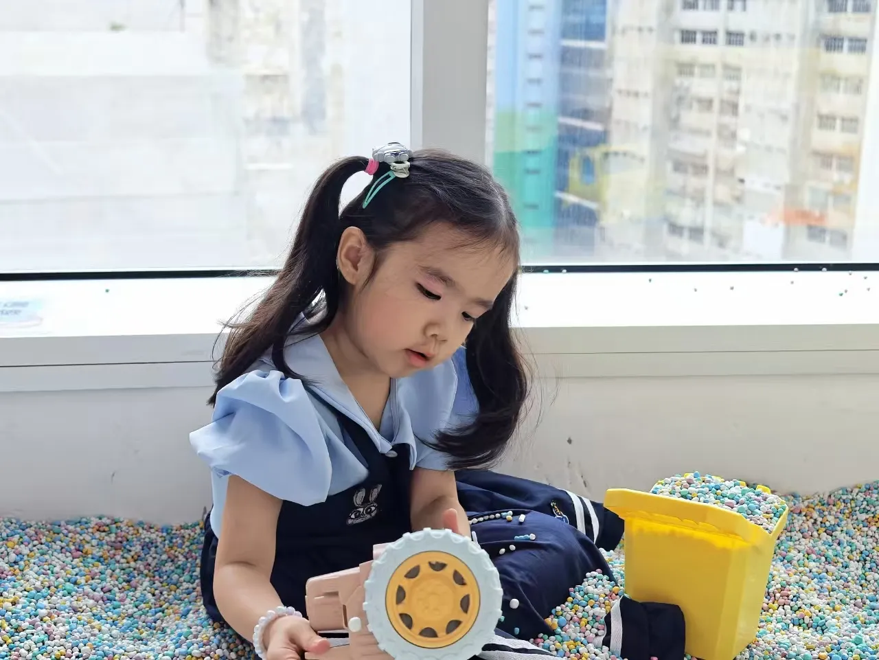 Child playing by the window, Kidstation Tsuen Wan